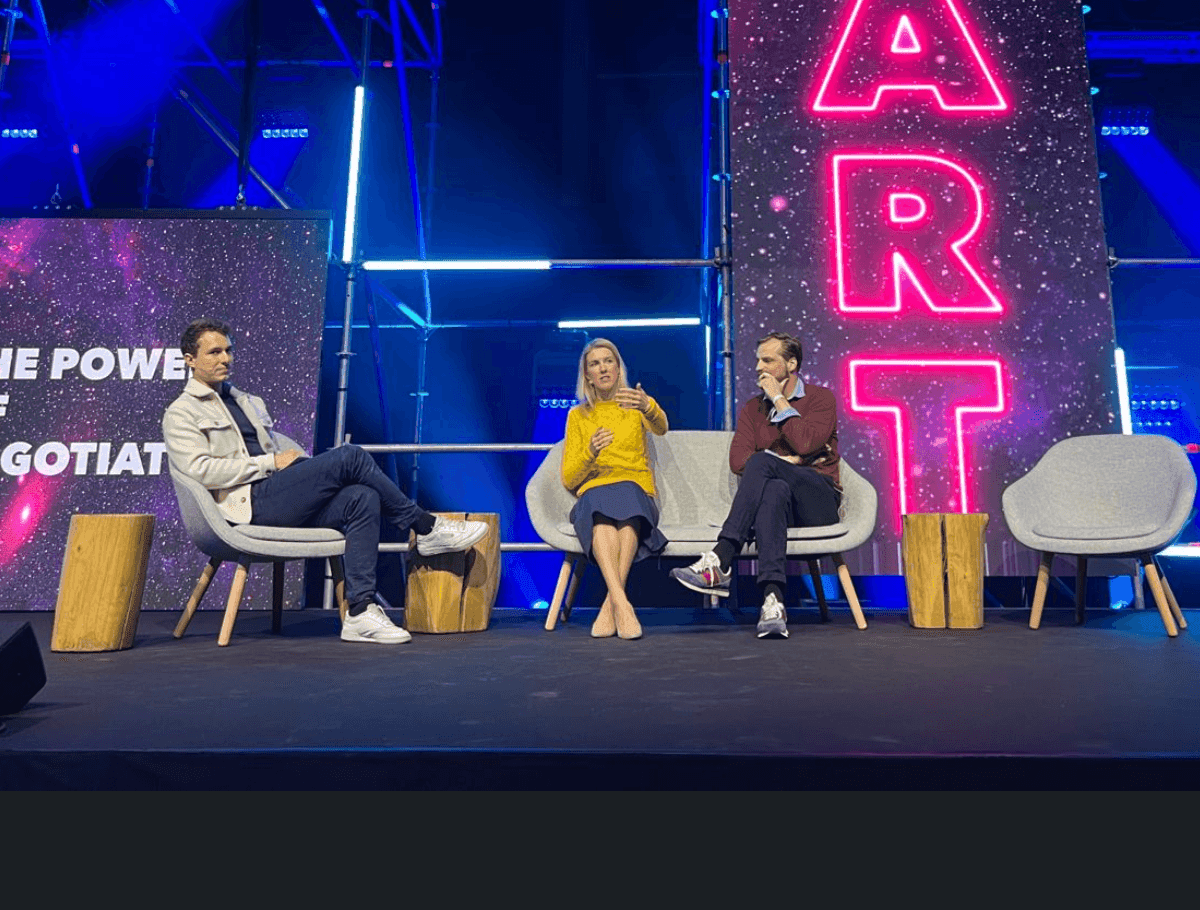 Kate Juenger speaking on stage